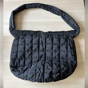 Black zip top puffer bag